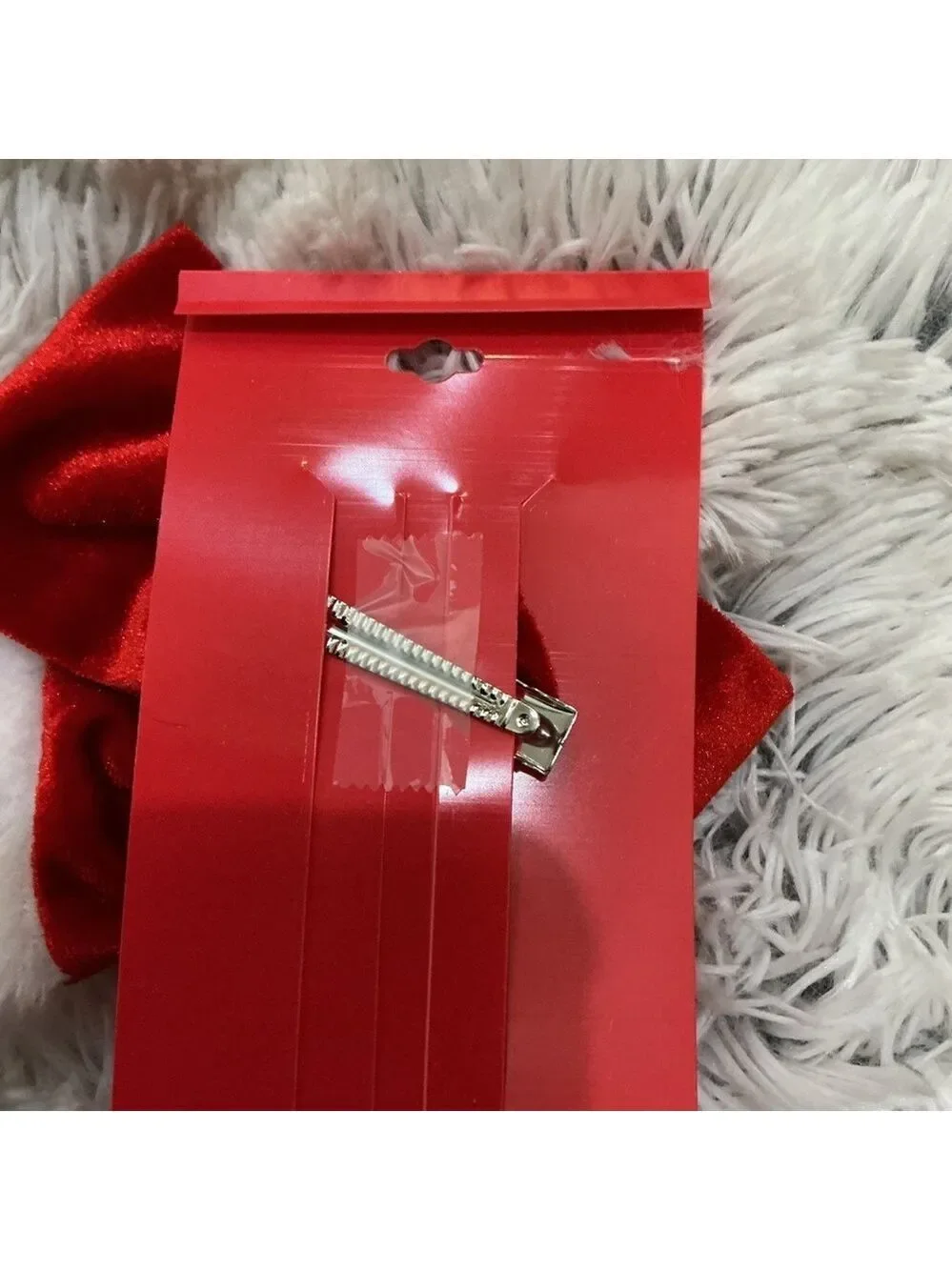 Celebrate Together oversized red velvet bow hair clip with white trim